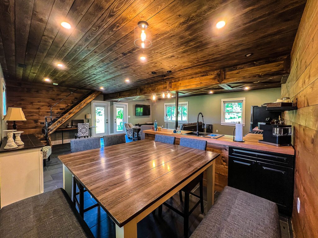 Rustic farmhouse kitchen with wood ceiling and island at The Wayback Cleveland vacation rental near Chagrin Falls