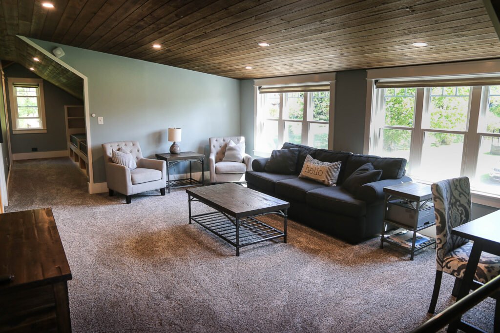 Spacious living room with seating and natural light at The Wayback vacation rental near Cleveland