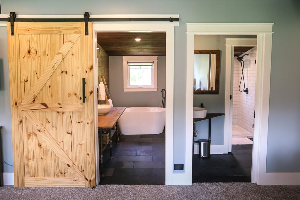 Rustic barn door hallway at The Wayback Cleveland vacation rental near Chagrin Falls