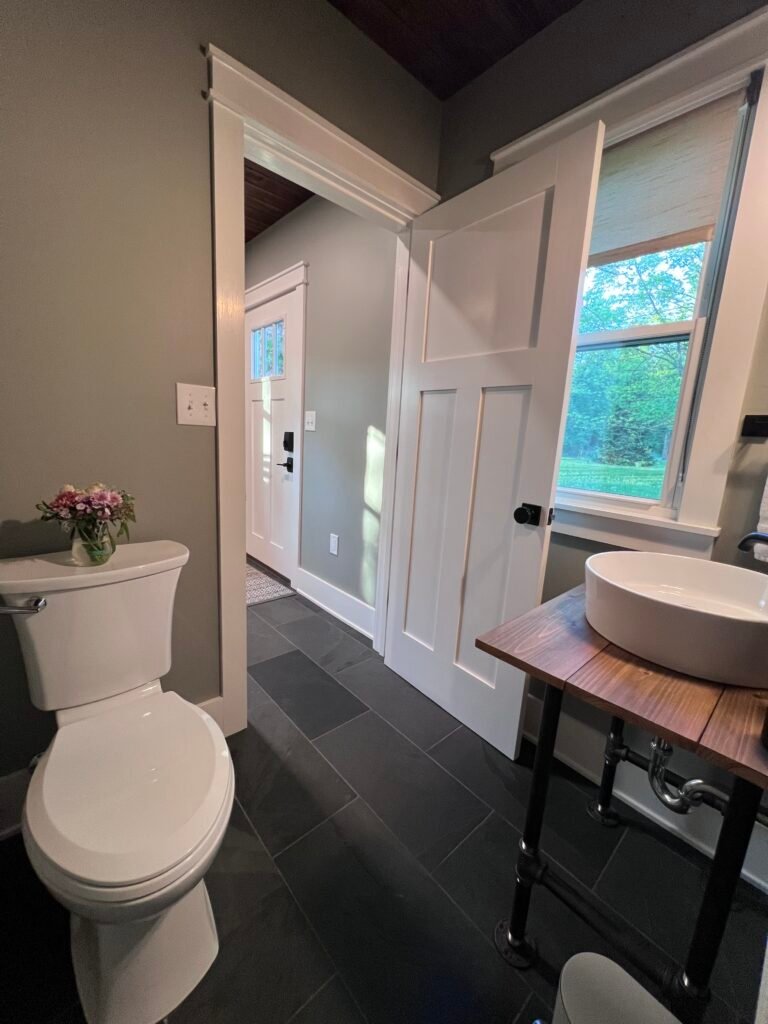 Bathroom vanity and toilet at The Wayback modern farmhouse vacation rental near Cleveland