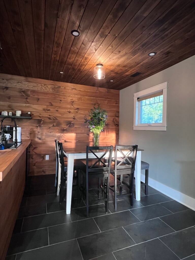 Dining table in rustic farmhouse kitchen at The Wayback Cleveland vacation rental