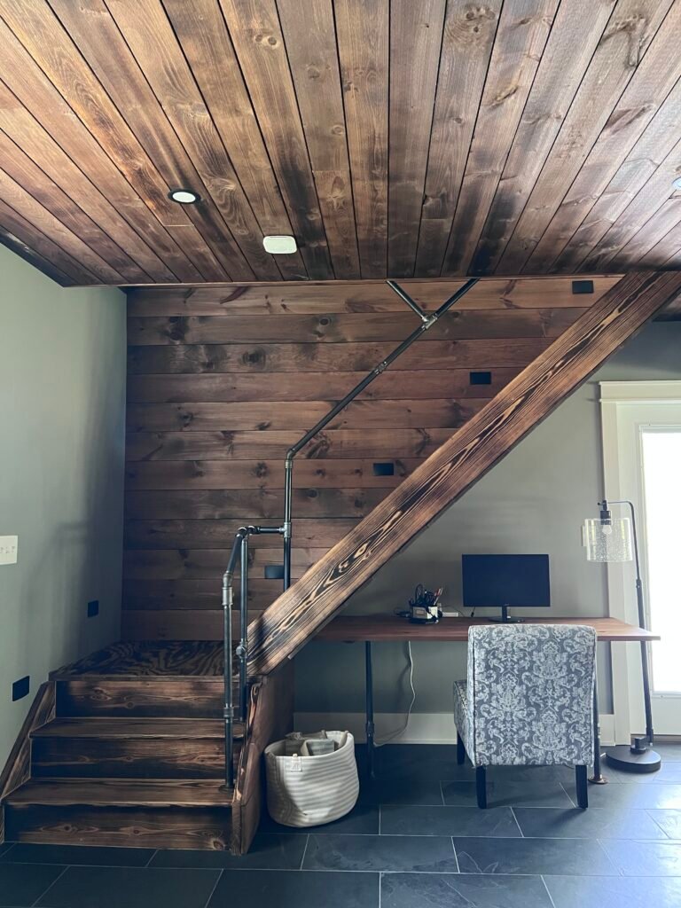 Rustic wood staircase and workspace desk at The Wayback Cleveland vacation rental near Chagrin Falls