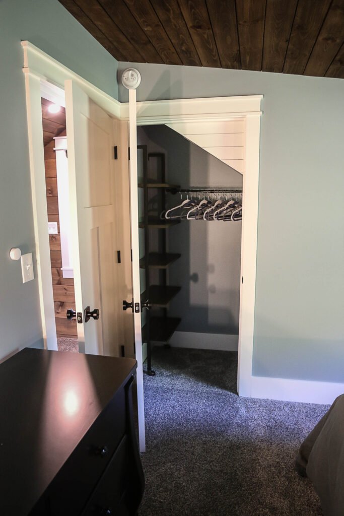Spacious bedroom closet with shelving and hanging space at The Wayback Cleveland vacation rental near Chagrin Falls